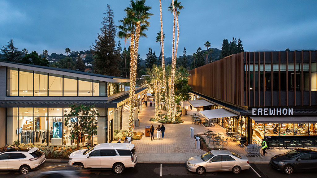 A street with cars and people.